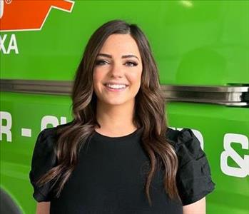 Woman standing in front of SERVPRO Fleet 