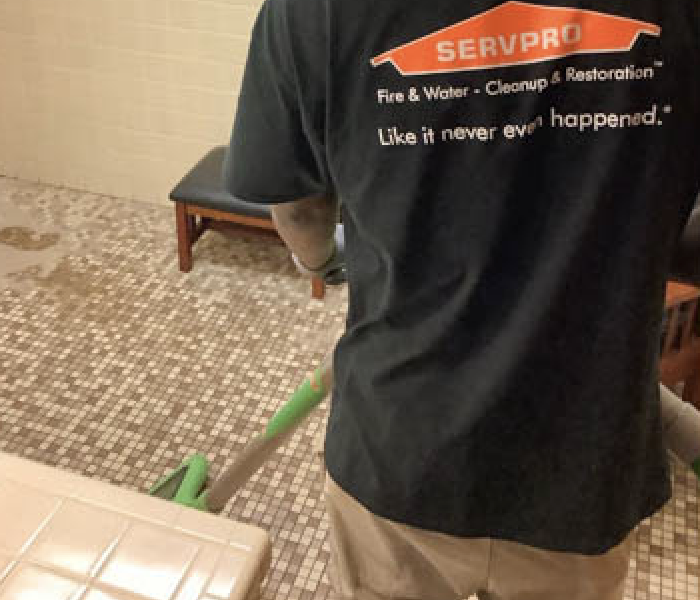 SERVPRO technician extracting excess water