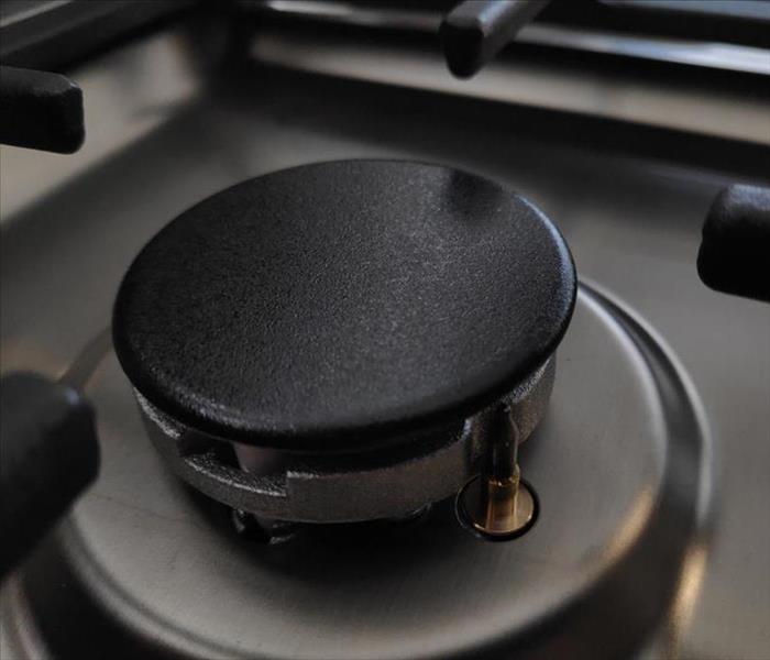 A burner cap on a gas stove.